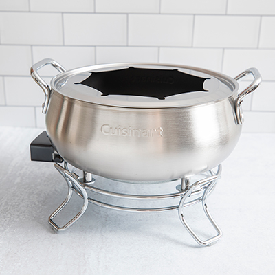 CUISINART<sup>&reg;</sup> Electric Fondue Set - The heating element is built into the base of the pot and a thermostat adjusts to a wide range of temperature settings. You can prepare chocolate, cheese, broth or oil fondue’s in this elegant 3 QT. brushed stainless pot. Cuisinart makes cleanup easy because the nonstick pot offers superb food release, and the entire unit is dishwasher safe.